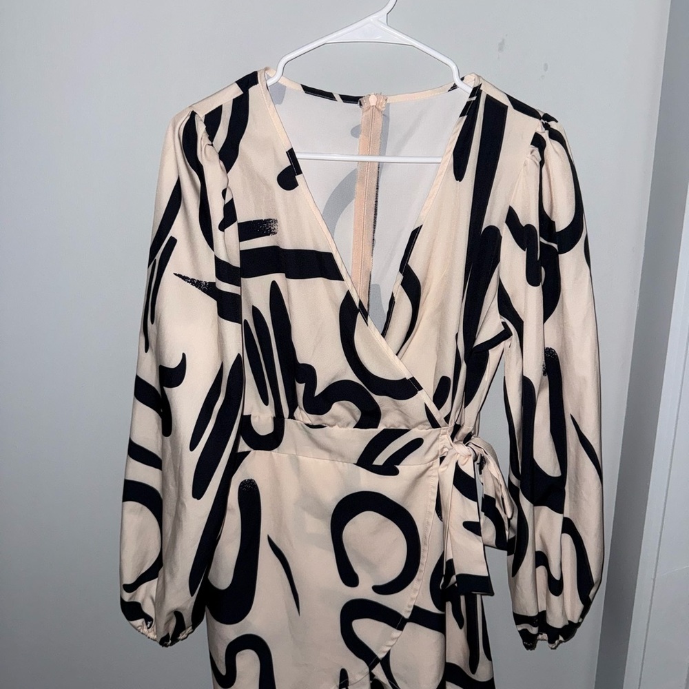 Elegant Cream and Black Wrap Romper